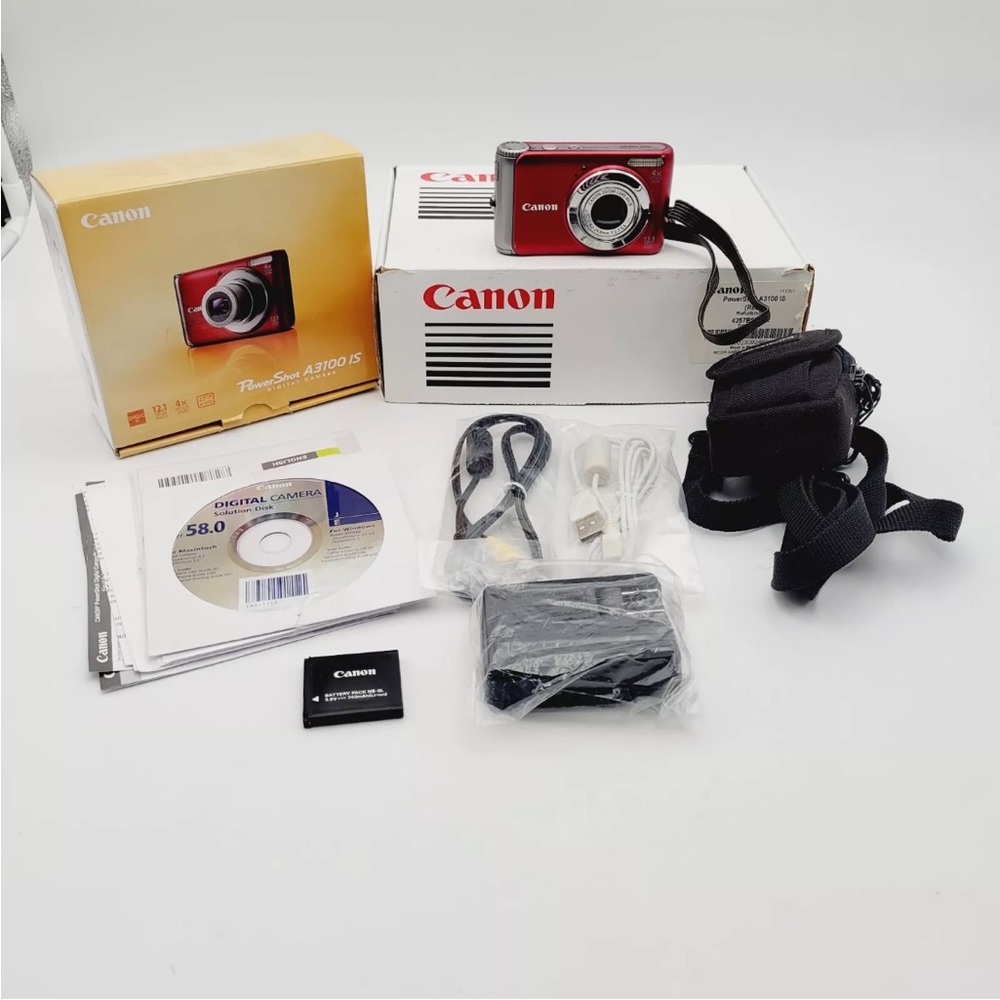 Canon PowerShot A3100 IS 12.1MP
Digital Camera Red Battery, Charger, CD